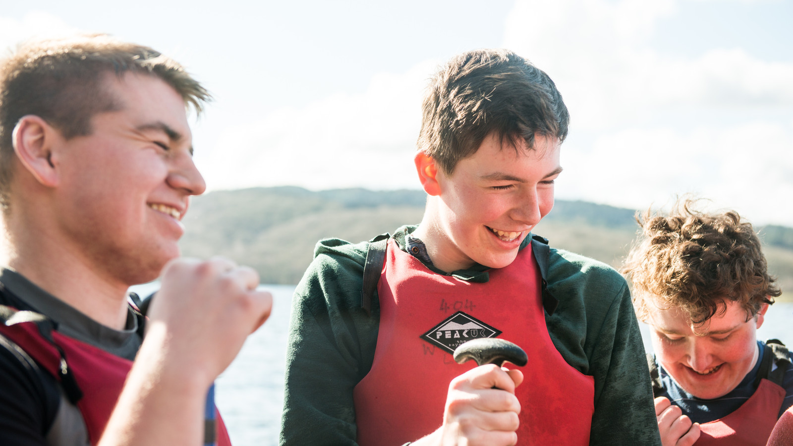 Scouts in life jackets chatting jpg