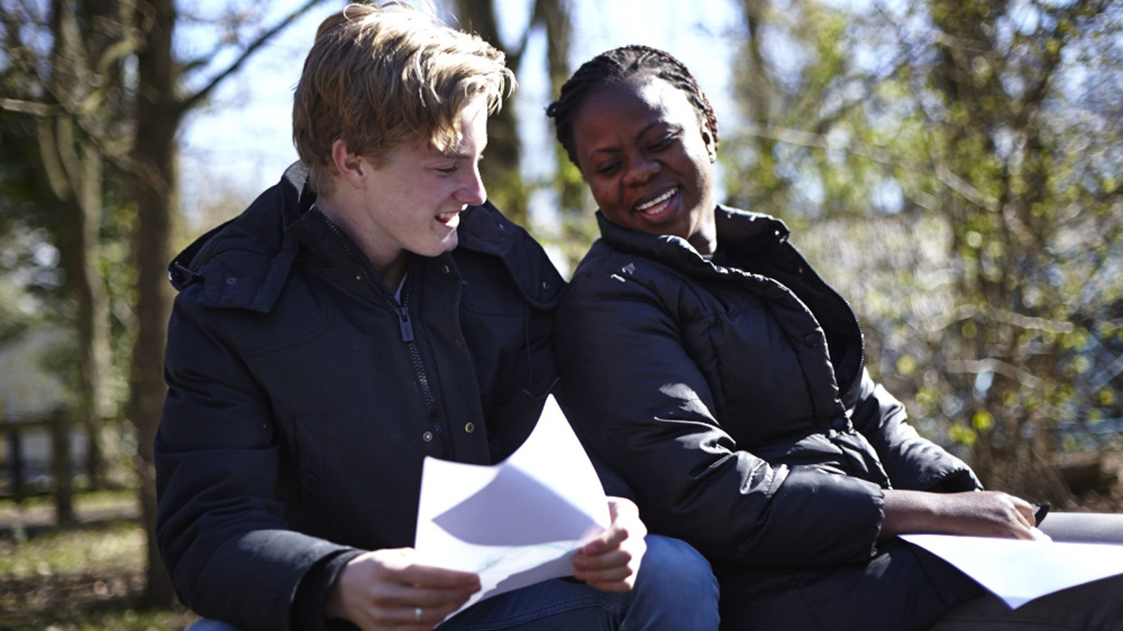 Male and female explorers map reading jpg