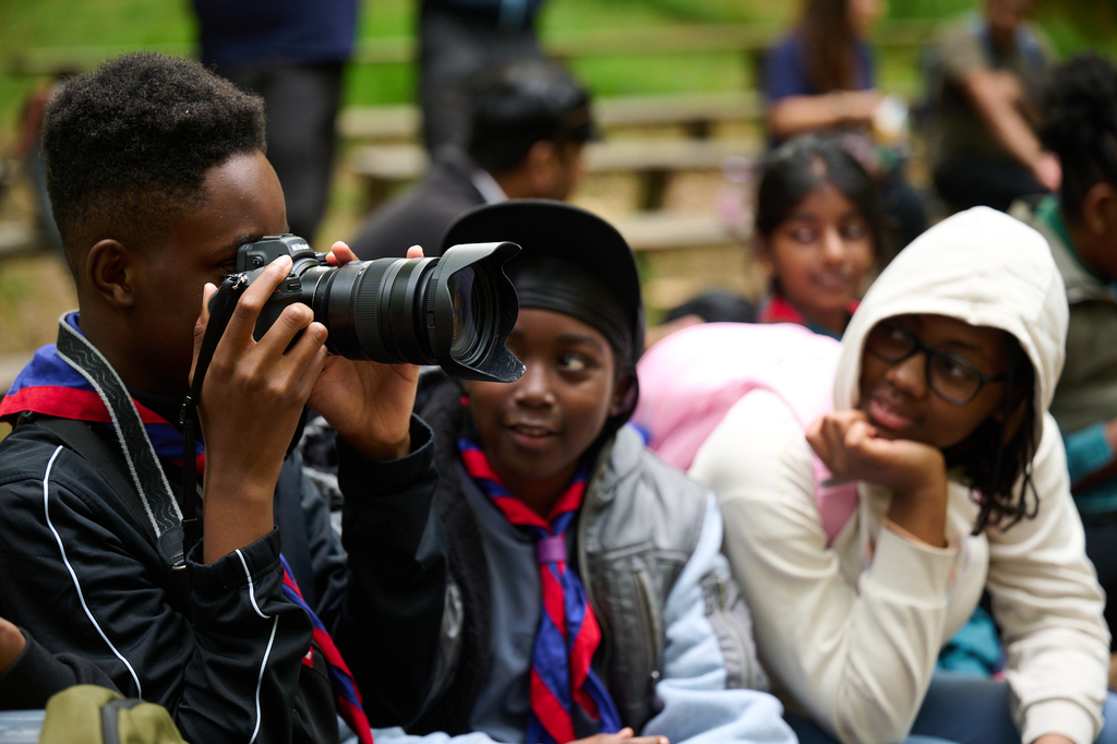 A group of scouts learning how to use a camera, all while learning skills for life.